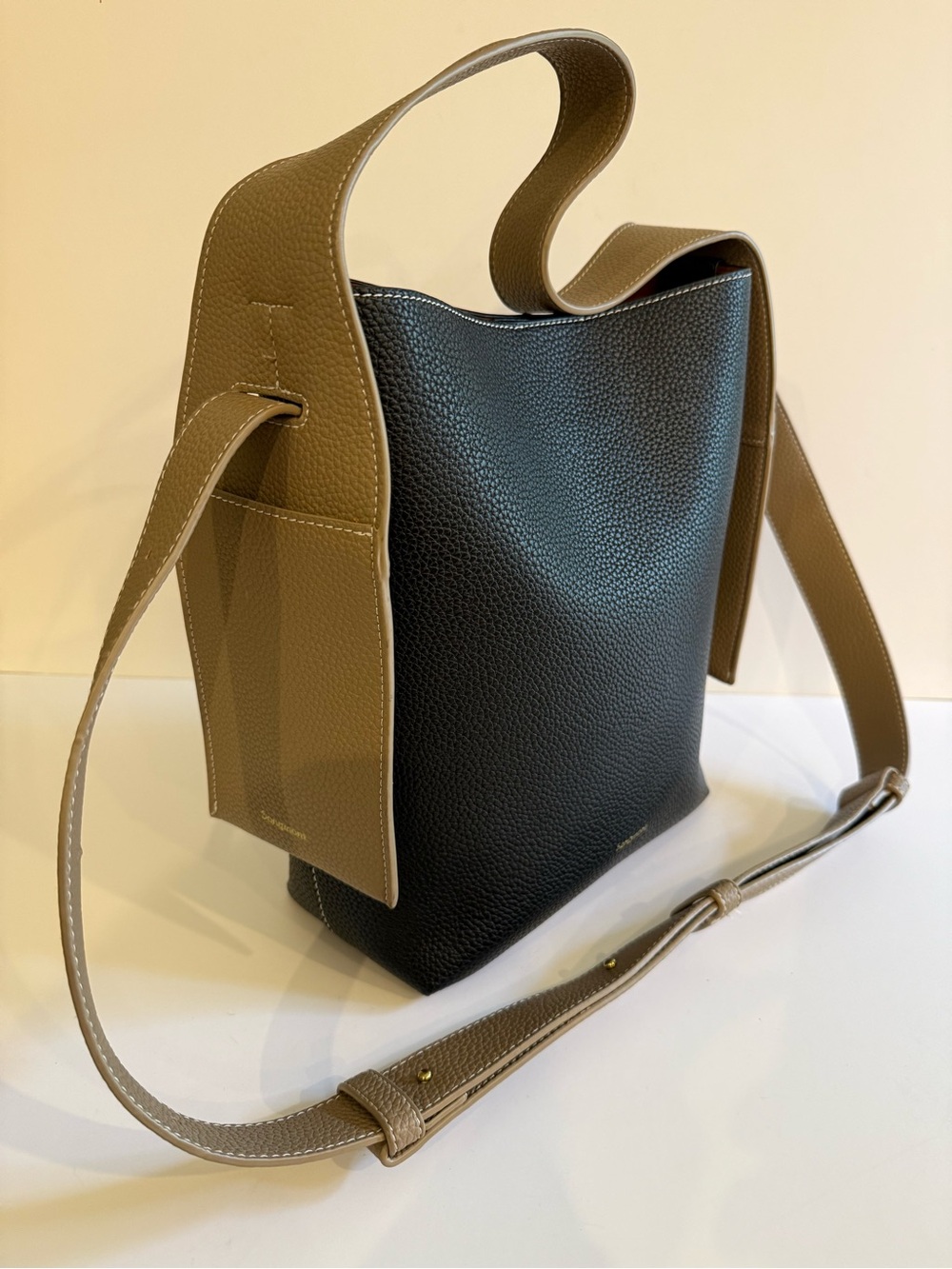 Songmont Drippy Tote in black pebbled leather, gold  logo, unique sides